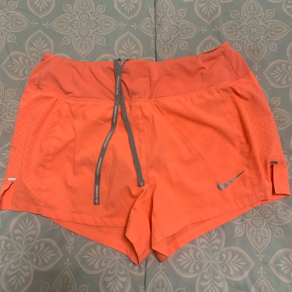 neon pink nike running shorts